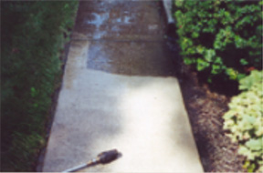 Exterior home pressure-wash cleaning of driveway