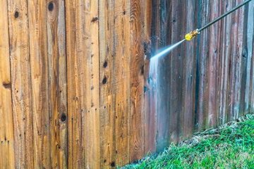Exterior home pressure-wash cleaning of fences